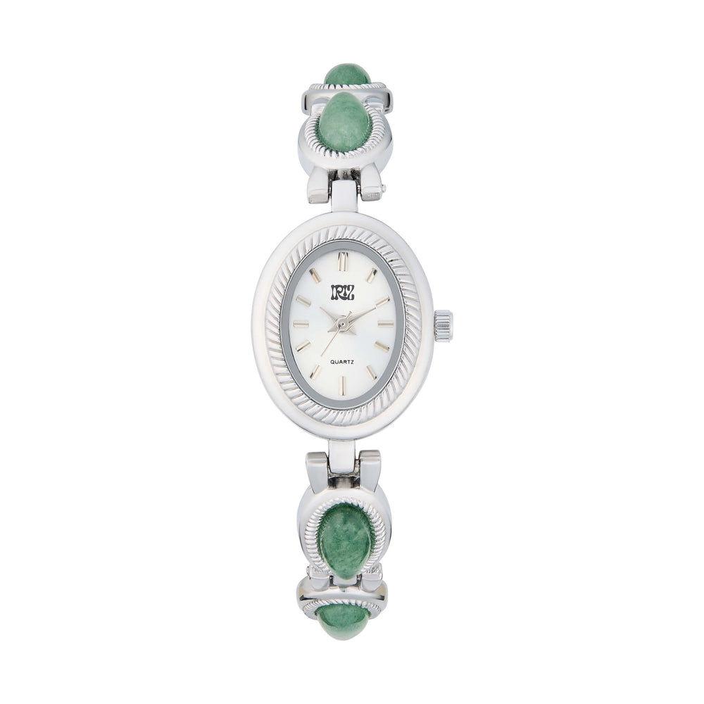 Silver watch with green gemstones in the band against a white background