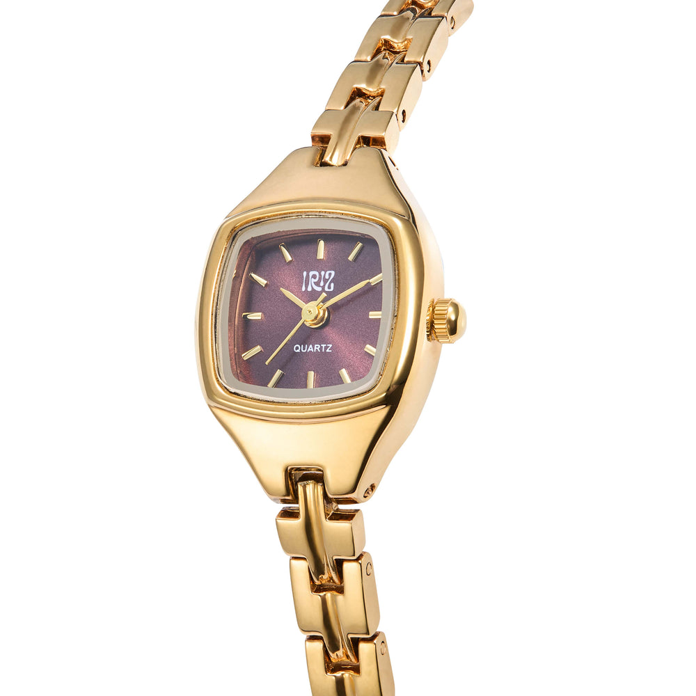 Gold wristwatch with a square burgundy face on a white background