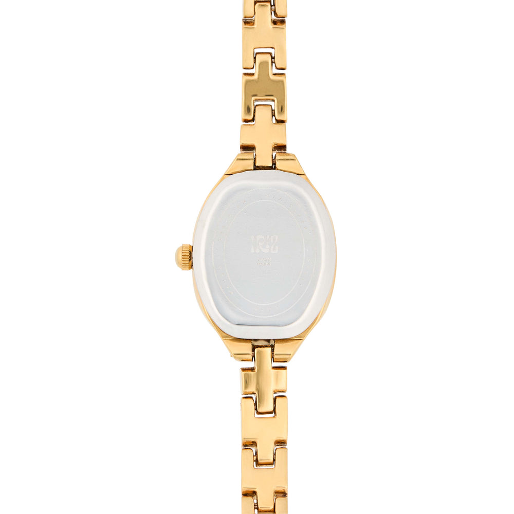 Back of a gold watch with a burgundy face against a white background