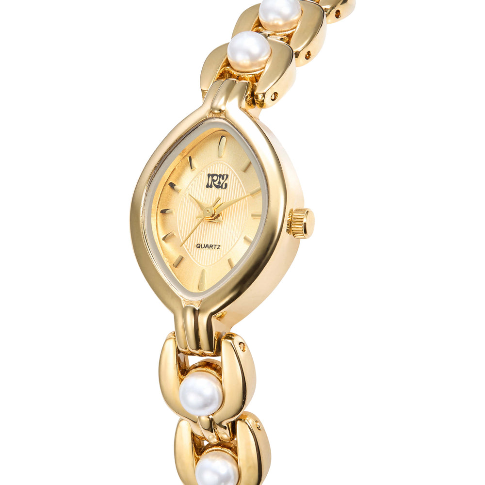 Teardrop faced gold watch with pearl-like accents on a white background