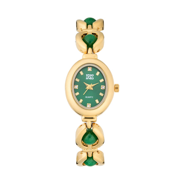 Closeup of Gold and green watch against a white background